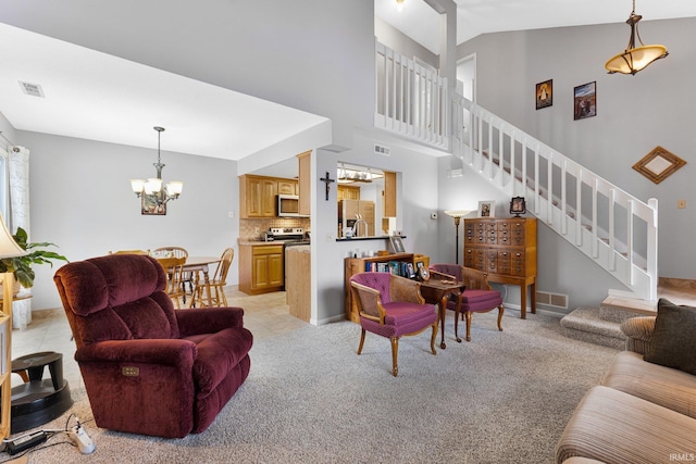 carpeted living room featuring lofted ceiling and a notable chandelier