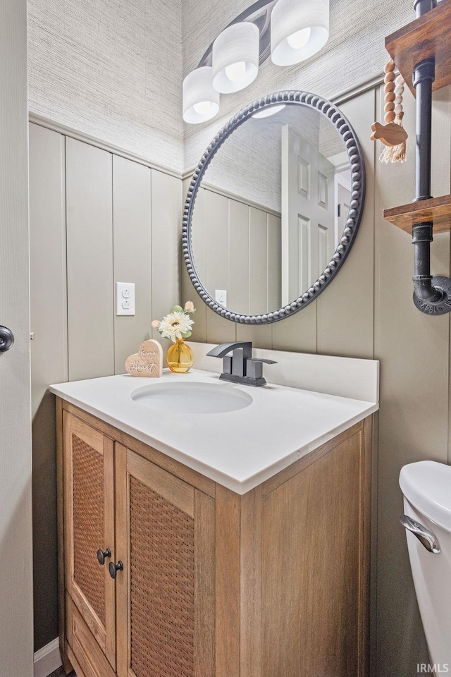 bathroom with vanity and toilet