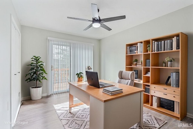 office featuring ceiling fan and light wood-type flooring