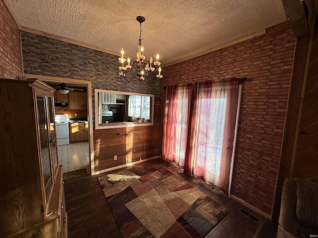 unfurnished dining area with dark wood-type flooring and a chandelier