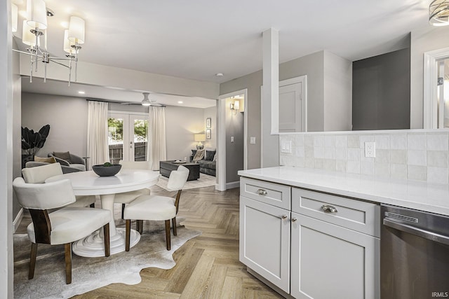 dining space with french doors and light parquet floors