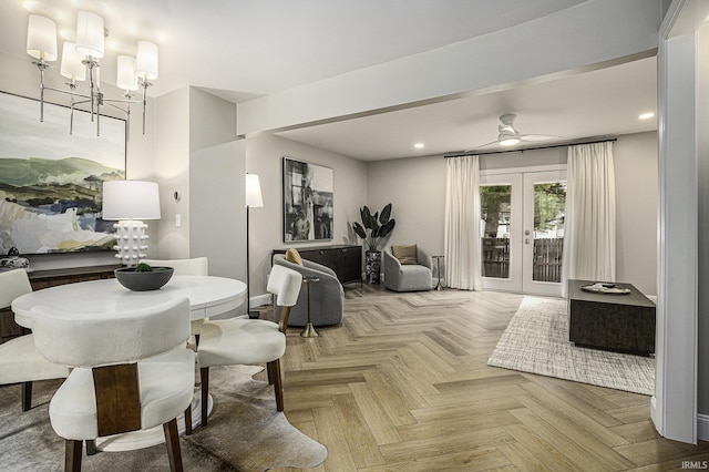 dining room featuring parquet flooring, ceiling fan with notable chandelier, and french doors