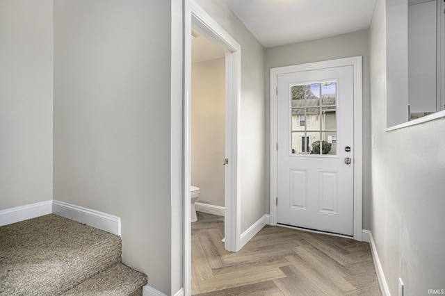 entryway with light parquet flooring