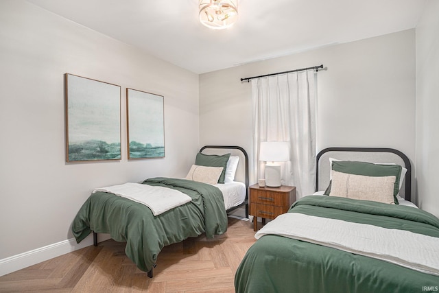 bedroom featuring light parquet floors