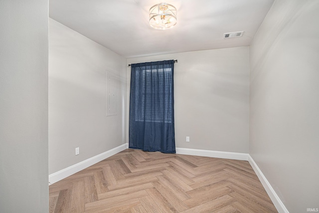 spare room with parquet floors