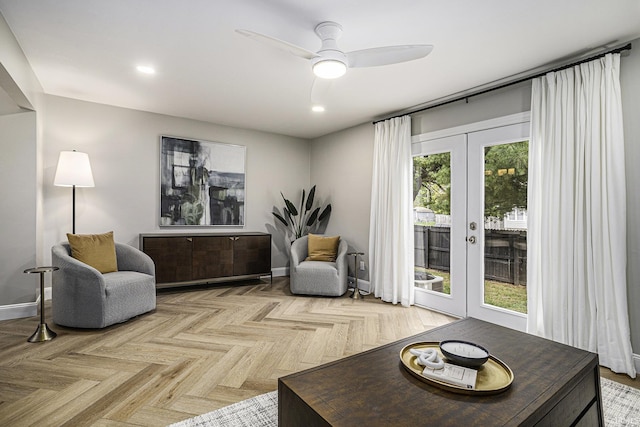 living area featuring ceiling fan, french doors, and light parquet floors