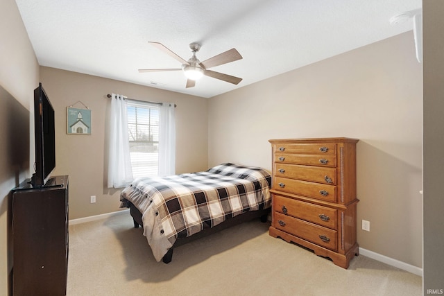 bedroom with light colored carpet and ceiling fan