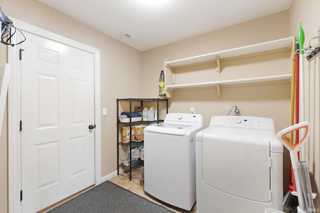 laundry area with washing machine and dryer