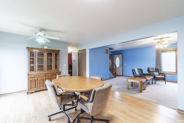 dining space featuring ceiling fan and light hardwood / wood-style floors