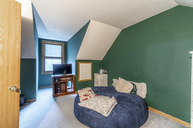 bedroom featuring light colored carpet, vaulted ceiling, and a textured ceiling