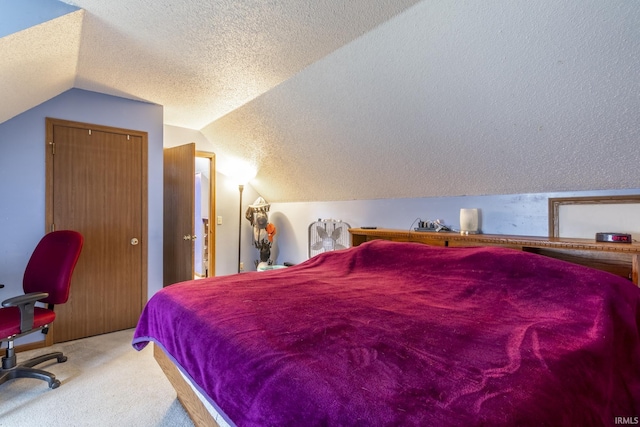 carpeted bedroom with lofted ceiling and a textured ceiling