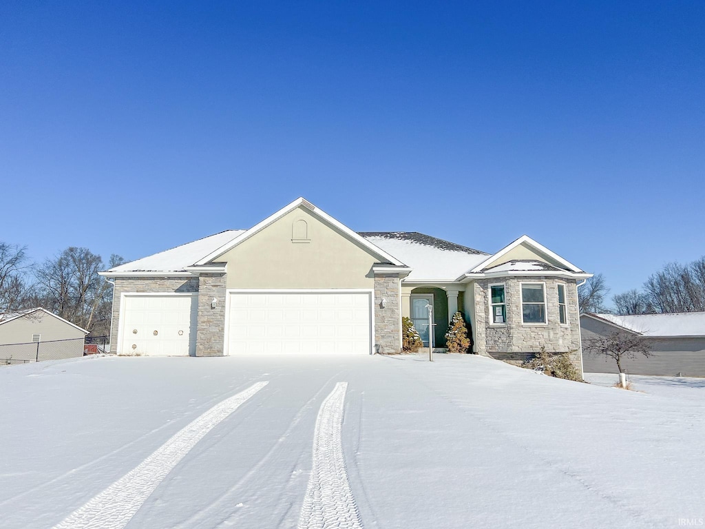 ranch-style house featuring a garage