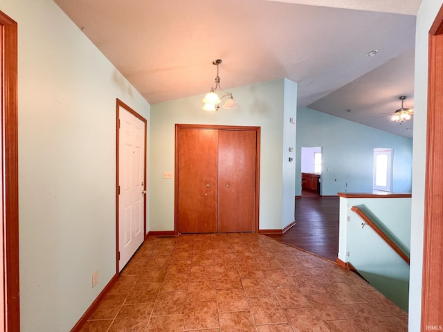 hall with lofted ceiling