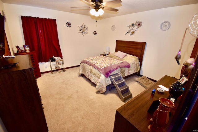 bedroom featuring ceiling fan and light colored carpet