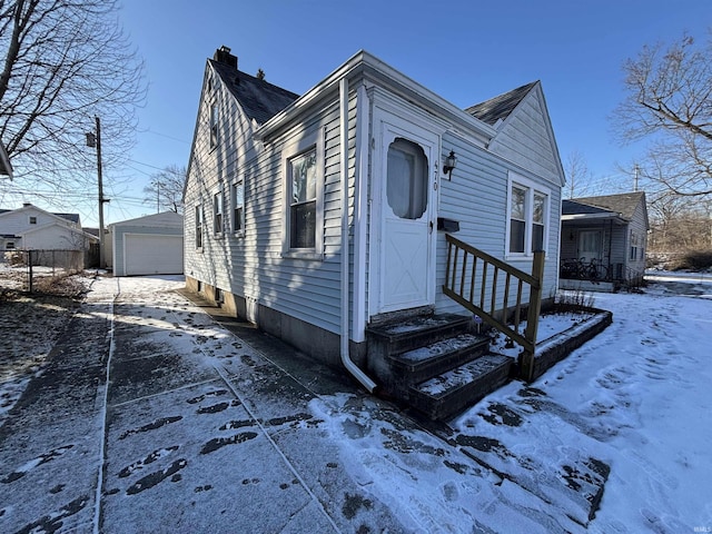 view of front of home featuring an outbuilding and a garage