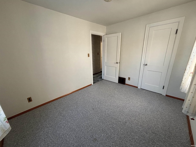 unfurnished bedroom with carpet floors