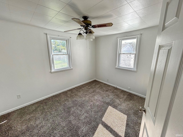 unfurnished room with carpet flooring and ceiling fan