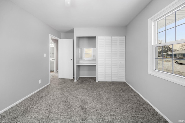 unfurnished bedroom featuring carpet flooring