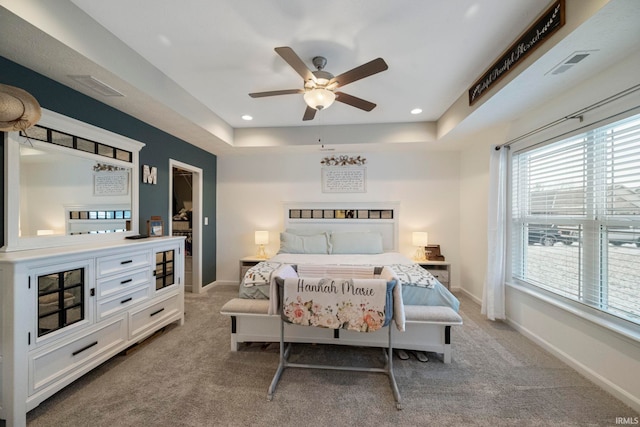 bedroom featuring light carpet, visible vents, and baseboards