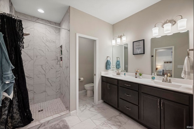 full bathroom featuring marble finish floor, a sink, a shower stall, and toilet