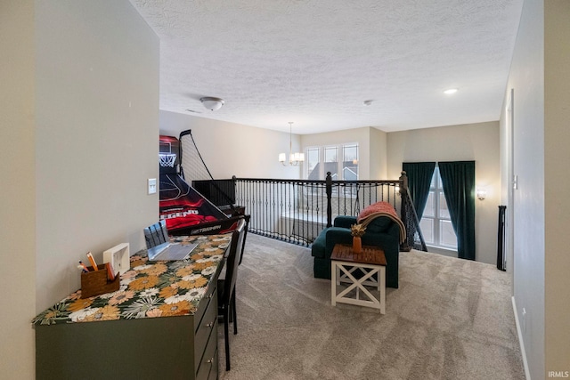 interior space with carpet floors, an inviting chandelier, and a textured ceiling