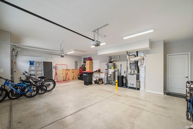 garage with heating unit, gas water heater, and a garage door opener