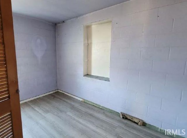 spare room featuring light wood-type flooring