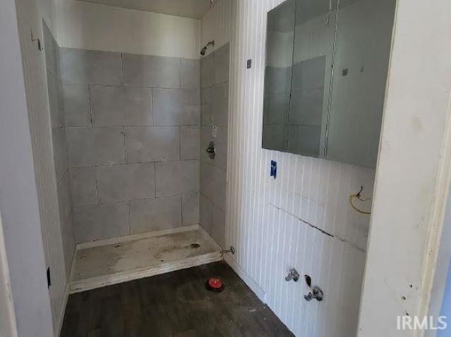 bathroom with tiled shower