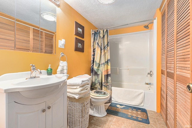 full bathroom featuring vanity, shower / tub combo, toilet, tile patterned floors, and a textured ceiling