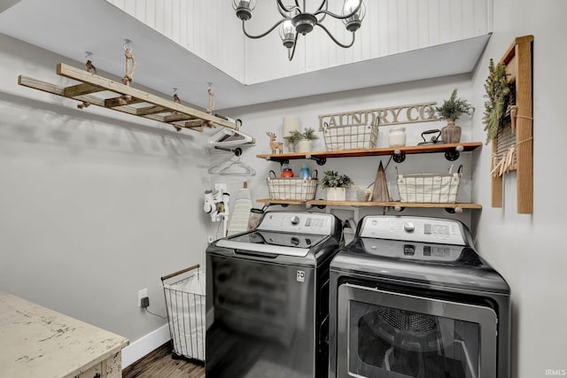 clothes washing area featuring hardwood / wood-style flooring and independent washer and dryer