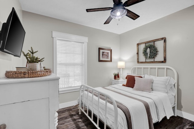 bedroom with dark wood-type flooring and ceiling fan