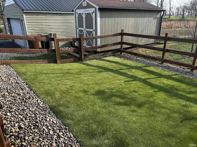 view of yard with a deck and a shed