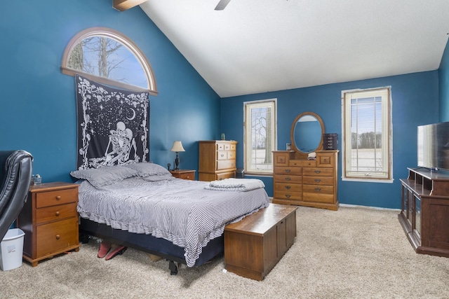 bedroom with vaulted ceiling, light colored carpet, and ceiling fan