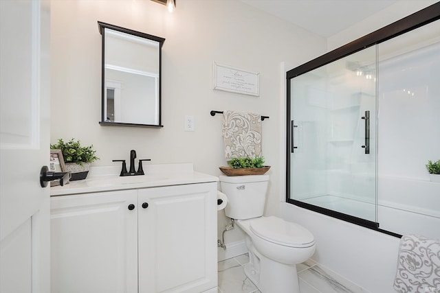 full bathroom featuring enclosed tub / shower combo, vanity, and toilet