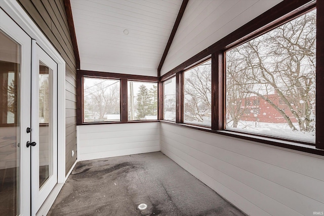 unfurnished sunroom with vaulted ceiling with beams, wooden ceiling, and french doors