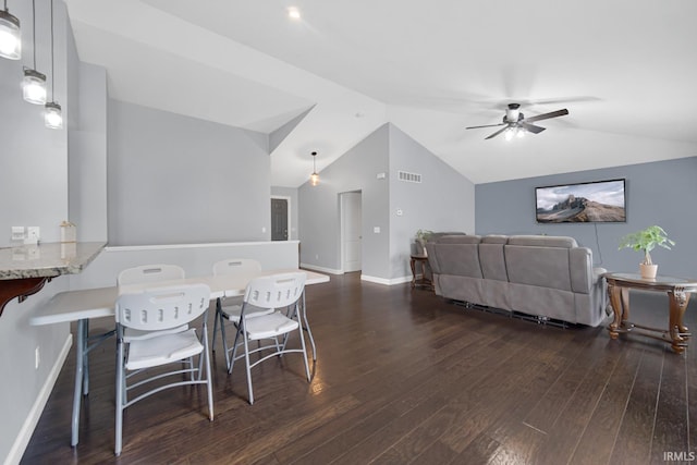 dining area with lofted ceiling, dark hardwood / wood-style floors, and ceiling fan