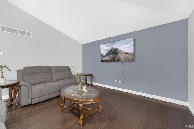 living room featuring vaulted ceiling and dark hardwood / wood-style floors