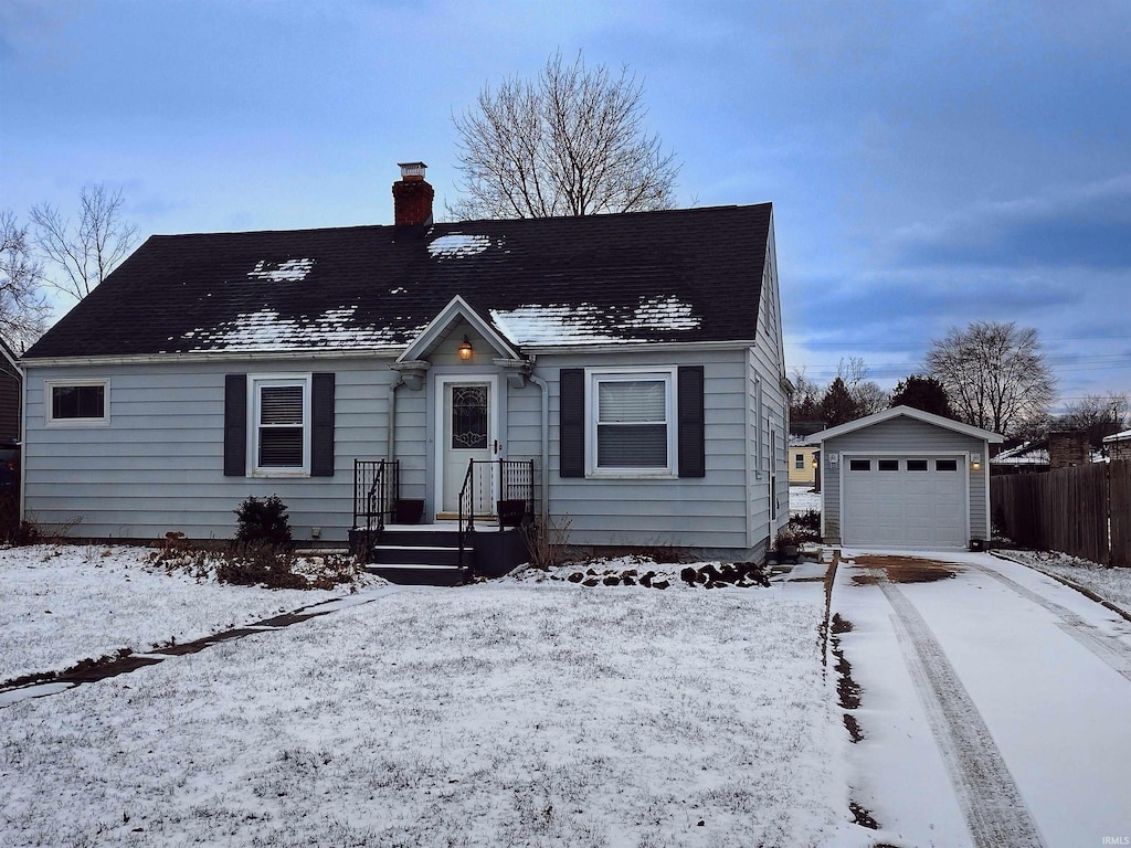 view of front facade with a garage and an outdoor structure