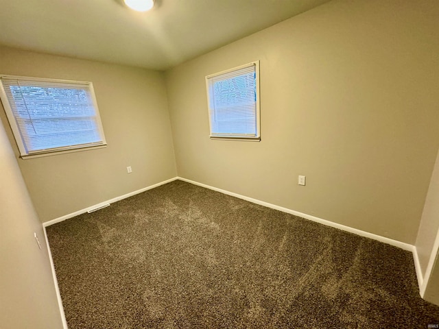 empty room featuring carpet floors