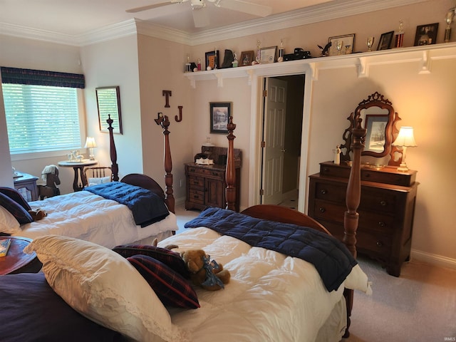 carpeted bedroom with ceiling fan and ornamental molding