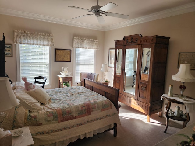 carpeted bedroom with crown molding and ceiling fan