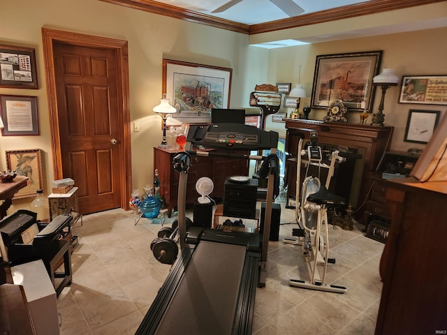 exercise area featuring crown molding