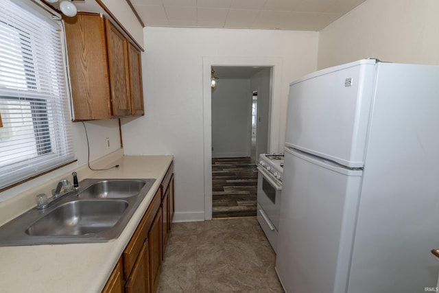 kitchen with sink and white appliances