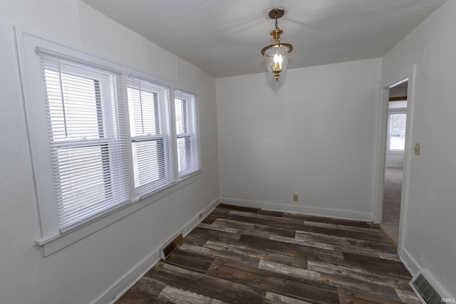 spare room with dark hardwood / wood-style flooring