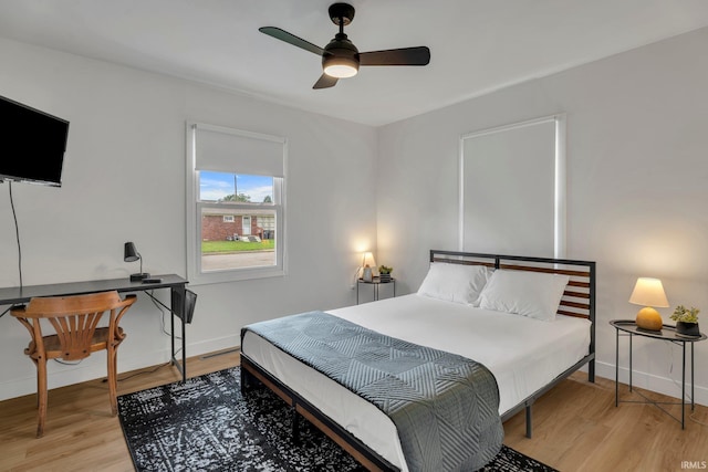 bedroom featuring ceiling fan and light hardwood / wood-style floors