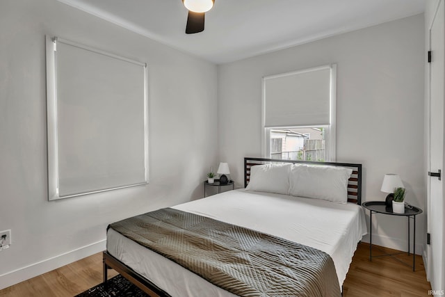 bedroom featuring hardwood / wood-style floors and ceiling fan