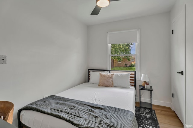 bedroom featuring ceiling fan and light hardwood / wood-style flooring