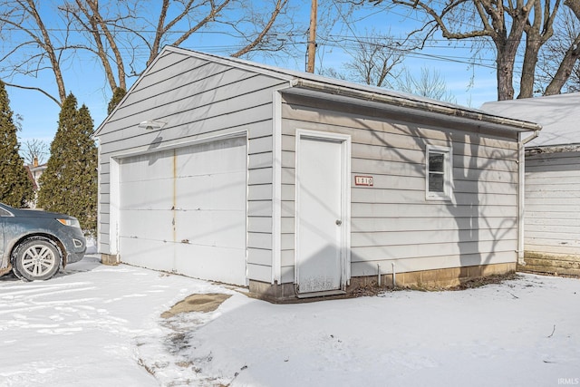 view of snow covered garage