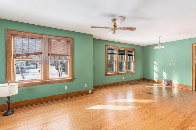 spare room with ceiling fan and light hardwood / wood-style flooring