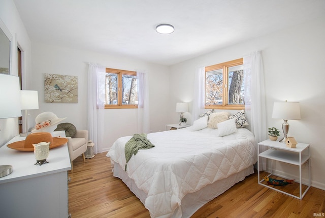 bedroom with light wood-type flooring